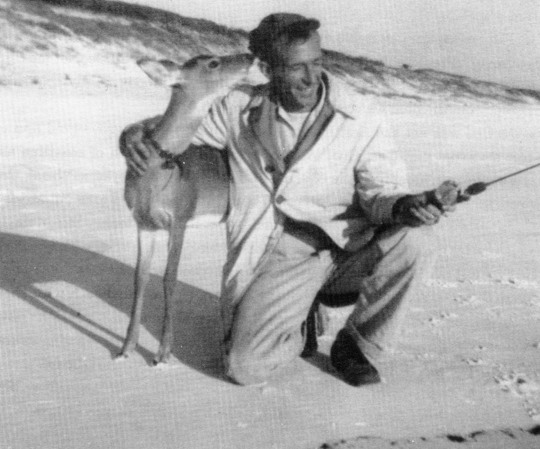 Cube McGee fishing on Seagrove Beach with the family pet deer Bambi in the early 1950s. Photo credit Cube McGee
